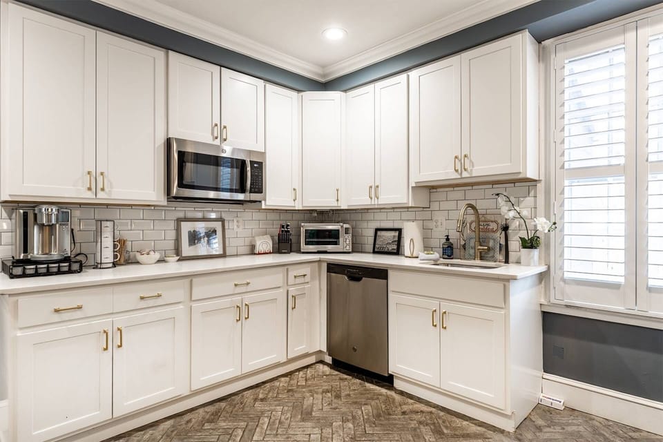 There's plenty of counter space and kitchen appliances (small and large) to prep for a family meal.