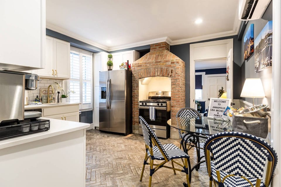 Enjoy gathering together around the kitchen table in the fully-stocked eat-in kitchen.