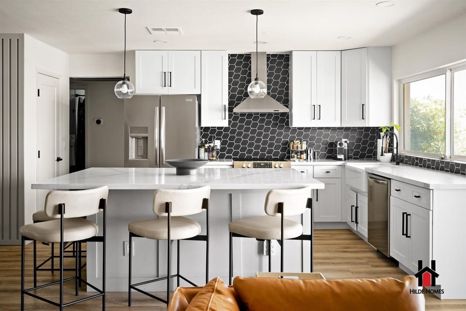An elegant Chef's Kitchen with a breakfast bar