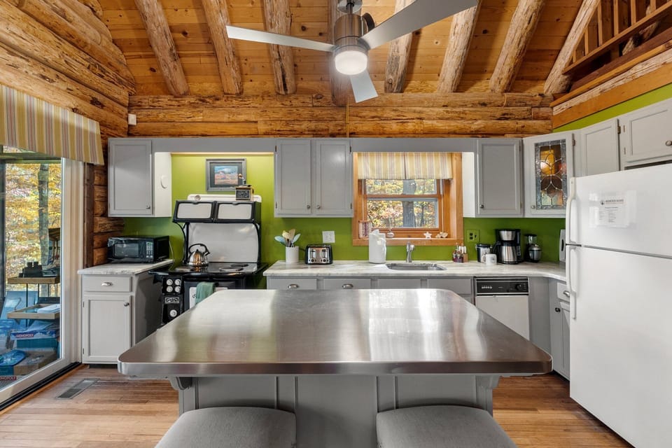 The antique kitchen oven/stovetop in this photo has been replaced with a brand-new and much more functional induction stovetop and oven.