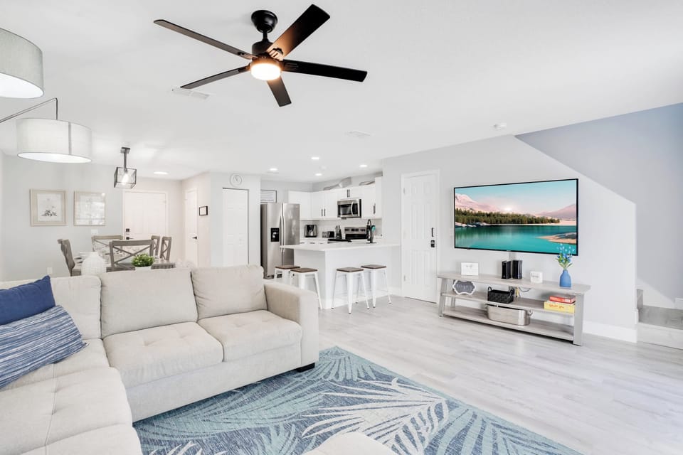 Open-concept living area with modern kitchen and comfortable seating for relaxing or entertaining.