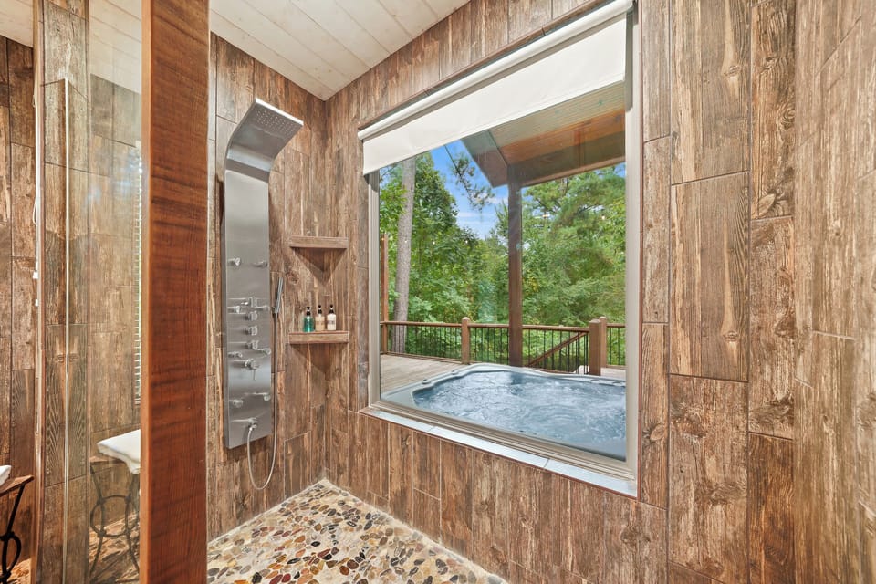 Our sleek and spacious shower looks out to our hot tub on the deck.