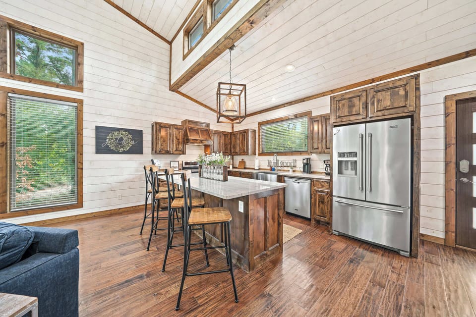 Just off the living room is our cozy kitchen with a dining counter that can seat 4.