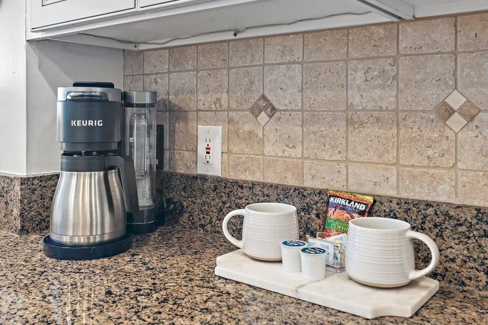 Start your mornings right with your own Keurig coffee station, complete with fresh mugs and premium coffee pods ready for brewing.