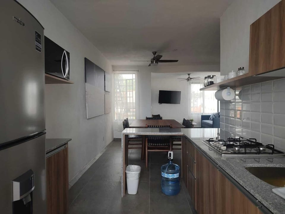 Microwave, stovetop, blender, cookware/dishes/utensils