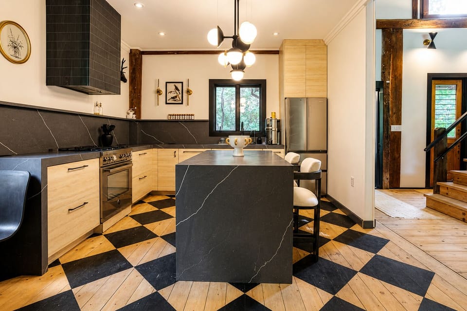 Modern appliances and ample space greet you in the chef’s kitchen.