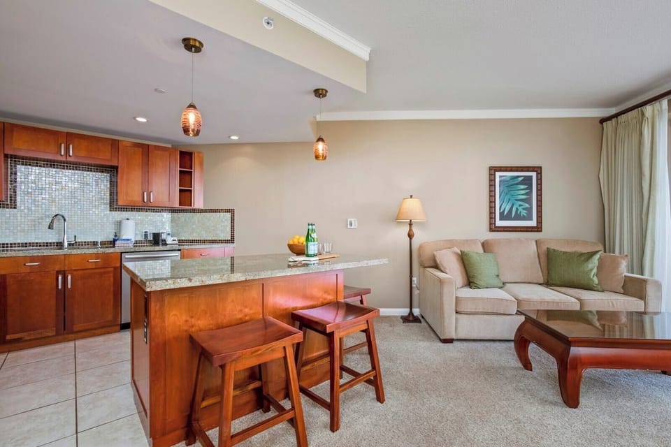 Gather around the island for morning coffee or a casual meal, with your kitchen and living space conveniently connected.