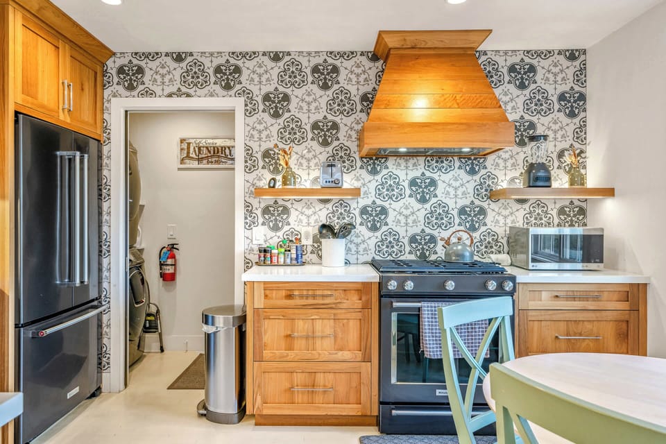 Private laundry is available for your stay, tucked away just beyond the kitchen