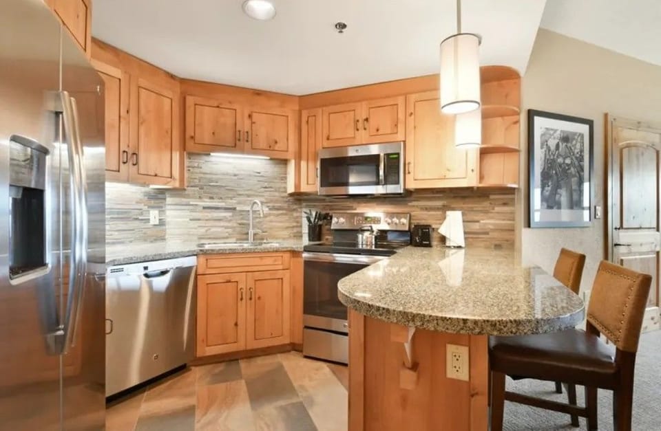 Fully equipped kitchen with modern appliances for gourmet meals.