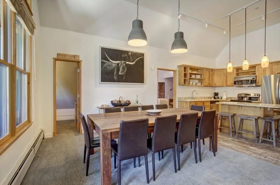 Spacious dining area with seating for eight, perfect for gatherings.