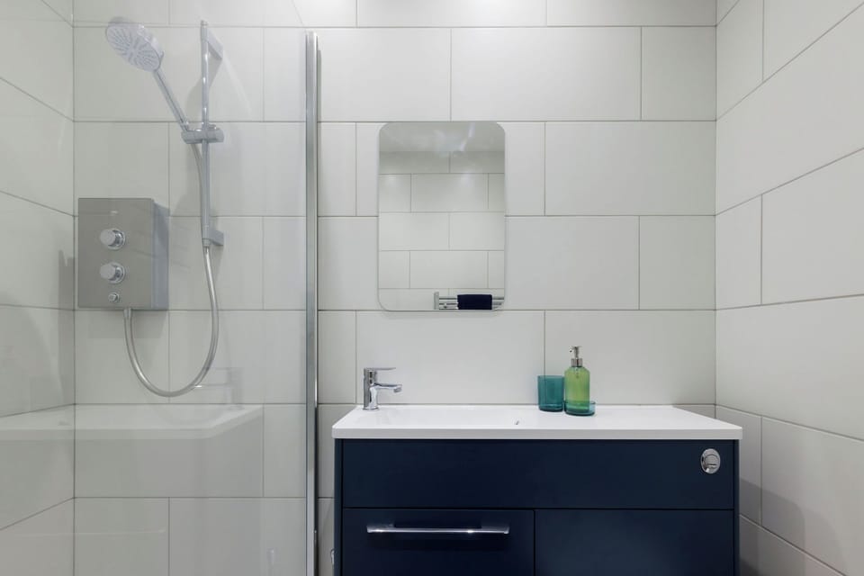 The apartment has a compact but functional bathroom.