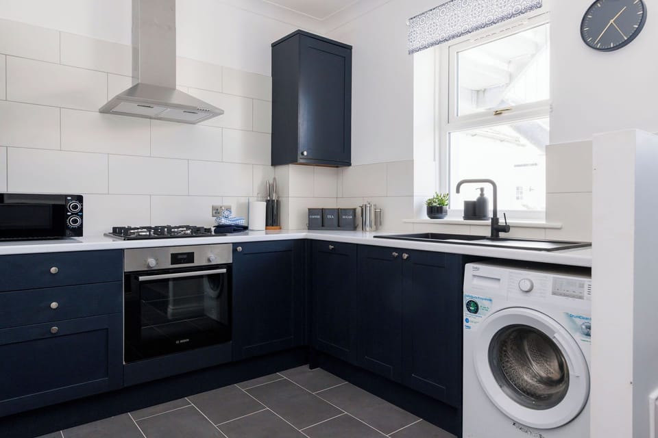 Enjoy preparing meals in the fully equipped kitchen. There is also a washing machine to keep on top of holiday laundry!