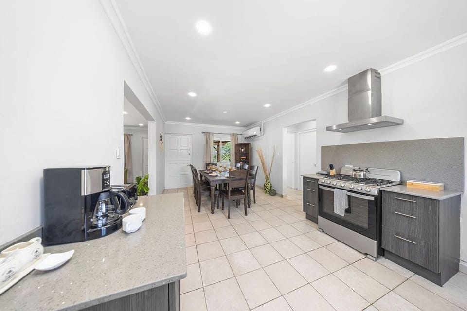 Experience seamless living in this inviting kitchen and dining area! Perfect for both casual meals and elegant gatherings, it’s the ideal space to nourish your culinary passions and create lasting memories.