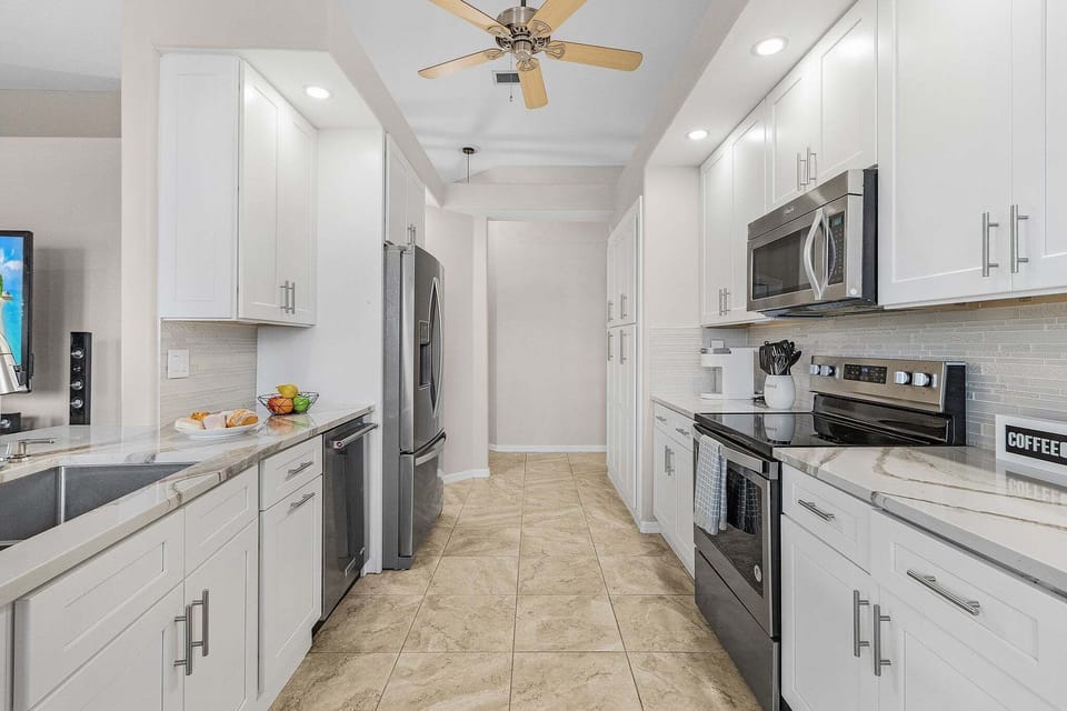 stainless steel appliances with plenty of dishes for the family.