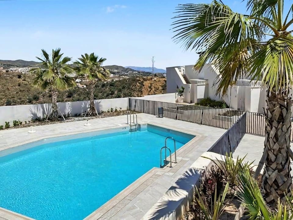 Take a refreshing swim in the saltwater pool right in front of the apartment