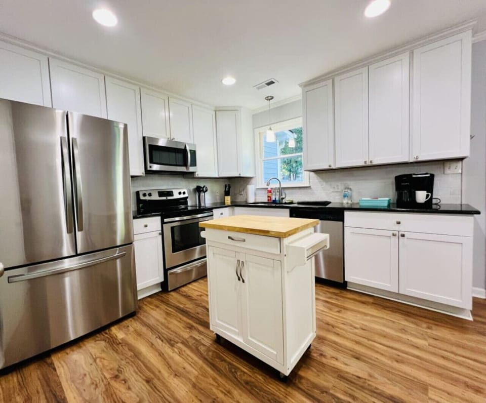 A spacious and functional kitchen, designed for both cooking and enjoying delicious meals.
