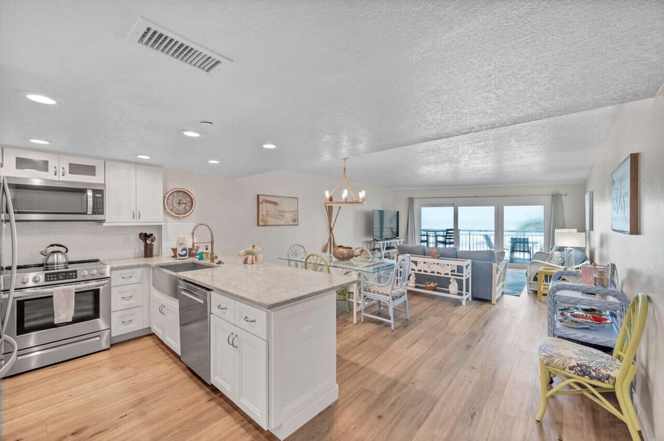 Spacious open-concept kitchen flows seamlessly into the main living area