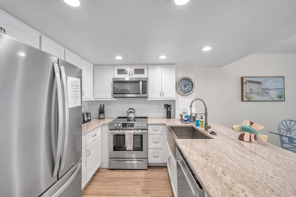 Modern kitchen w/ ample counter space for prepping and serving favorites.