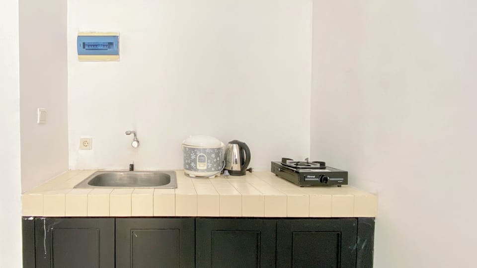 Apartment | Private kitchen | Fridge, stovetop, rice cooker, dining tables