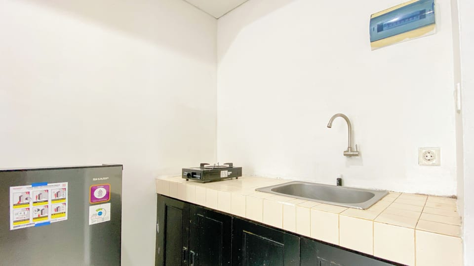 Apartment | Private kitchen | Fridge, stovetop, rice cooker, dining tables