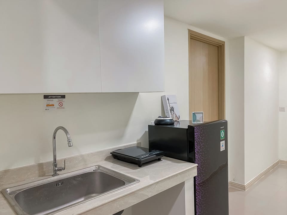 Apartment | Private kitchen | Full-size fridge, stovetop, rice cooker, dining tables