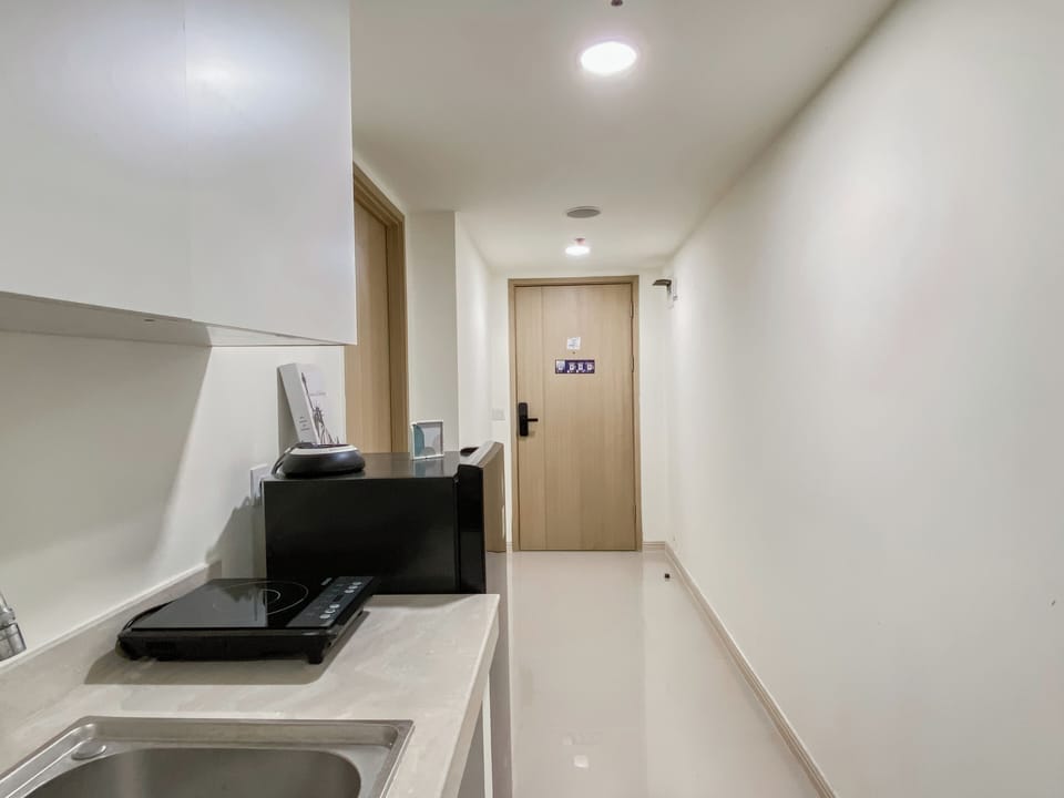 Apartment | Private kitchen | Full-size fridge, stovetop, rice cooker, dining tables