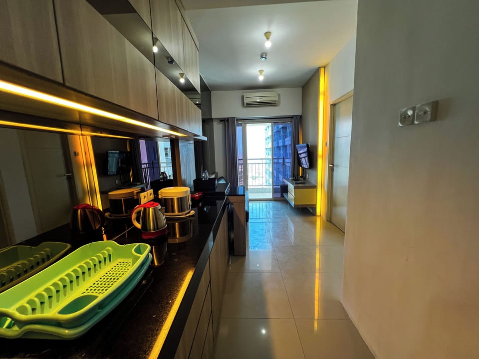 Apartment | Private kitchen | Mini-fridge, stovetop, rice cooker, dining tables