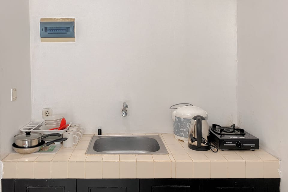 Apartment | Private kitchen | Fridge, stovetop, rice cooker, dining tables