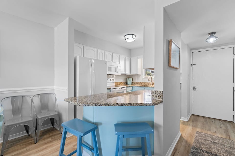 Breakfast bar area with seating for two