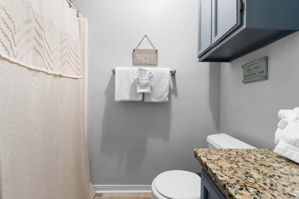 Hall bathroom featuring walk-in shower