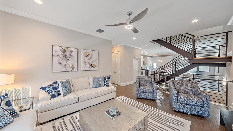 Spacious open-concept living area with coastal décor and plenty of seating, ideal for gathering before heading out to Sarasota’s beaches and attractions.