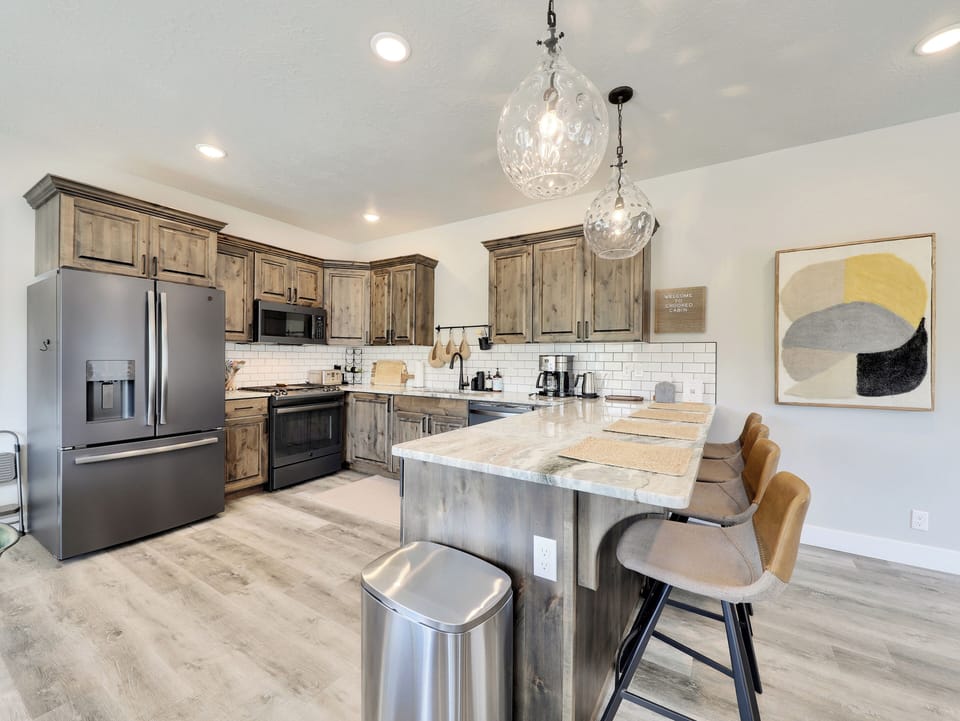 View of Fully Loaded Kitchen: The kitchen is fully equipped with high-end appliances and a spacious layout
