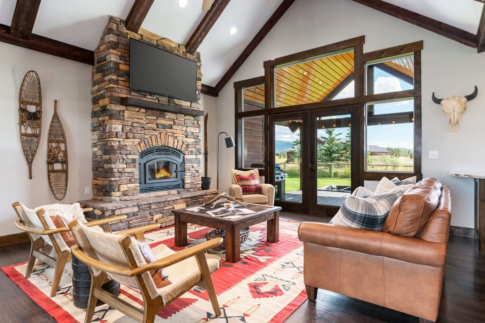 The well-appointed and well-lit living space has easy access to the backyard. Unique western decor can be found throughout the home.
