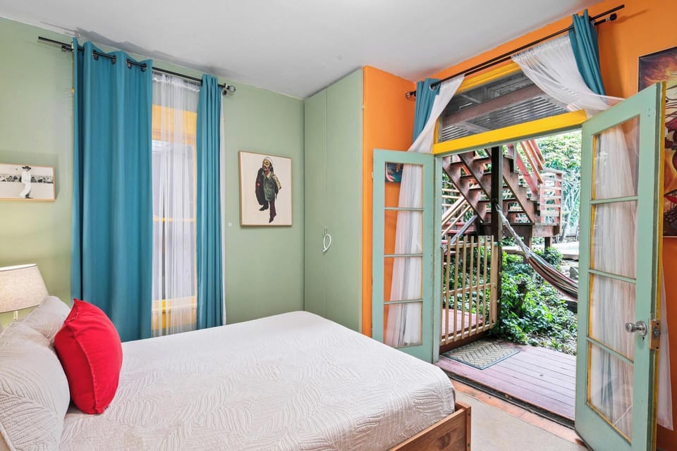 Bedroom 3, Natural light, direct garden access, and rich artistic accents
