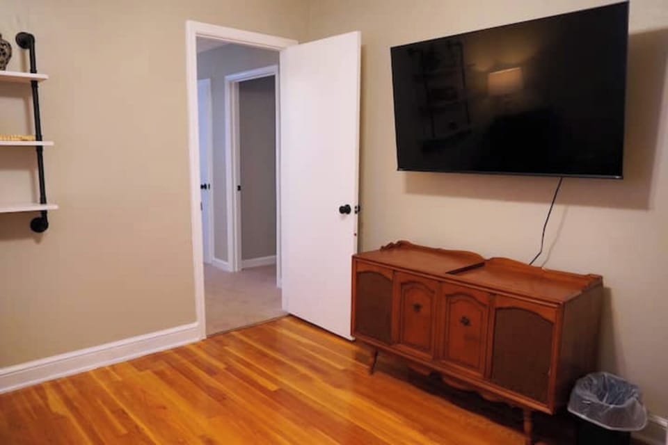 Family Room with 3 Recliners, TV, Games, and a Charging Station