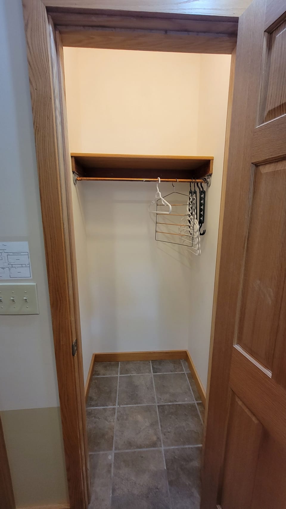 main bedroom closet with hangers