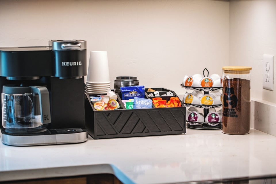 Ground coffee, Keurig cups, tea, honey, sugar, honey, creamers, & hot choc.