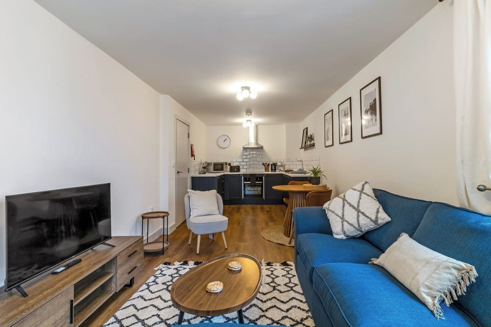 Apartment, City View | Living area | Flat-screen TV