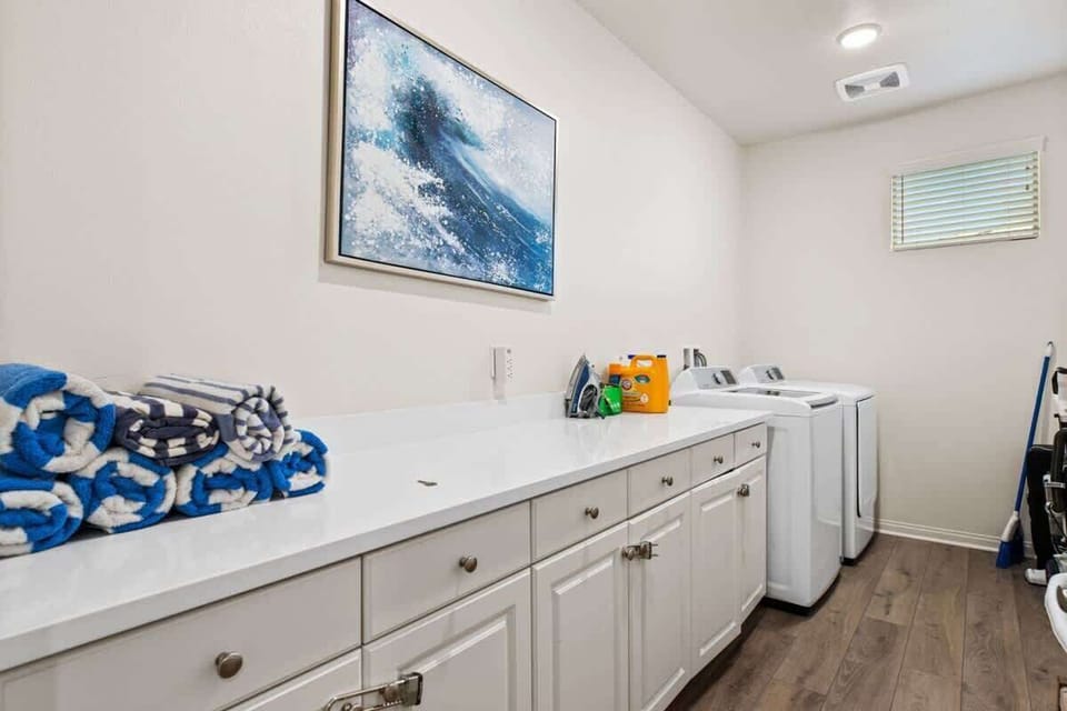 Convenient laundry room with washer and dryer.