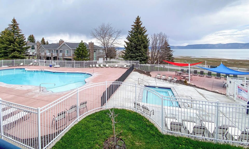 Access to outdoor heated seasonal pool with view of Bear Lake