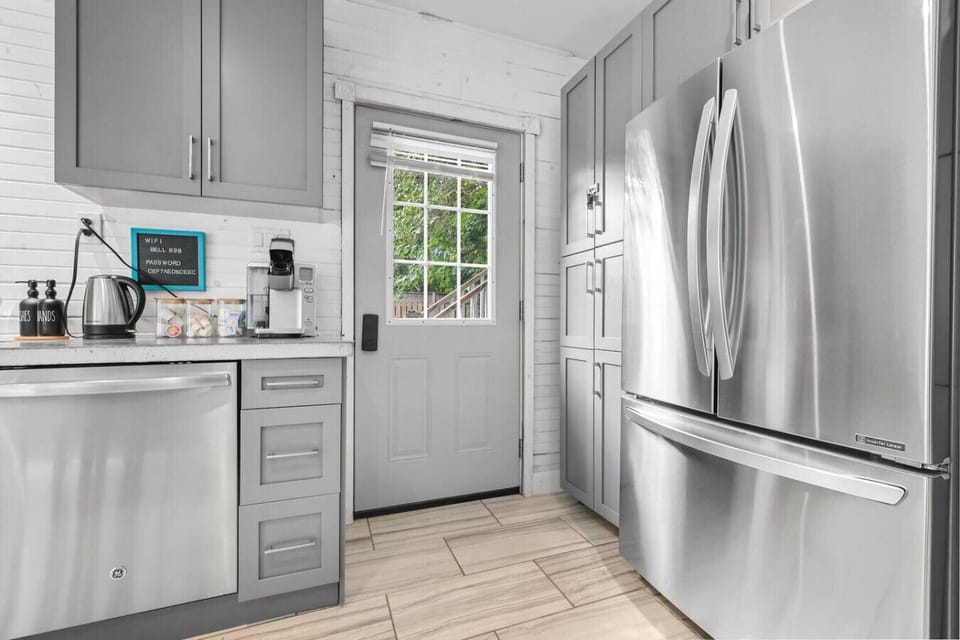Welcome to a kitchen where style meets function. Equipped with all the essentials, including a large fridge and a coffee maker, you have everything you need to create meals or brew your favorite morning drink.
