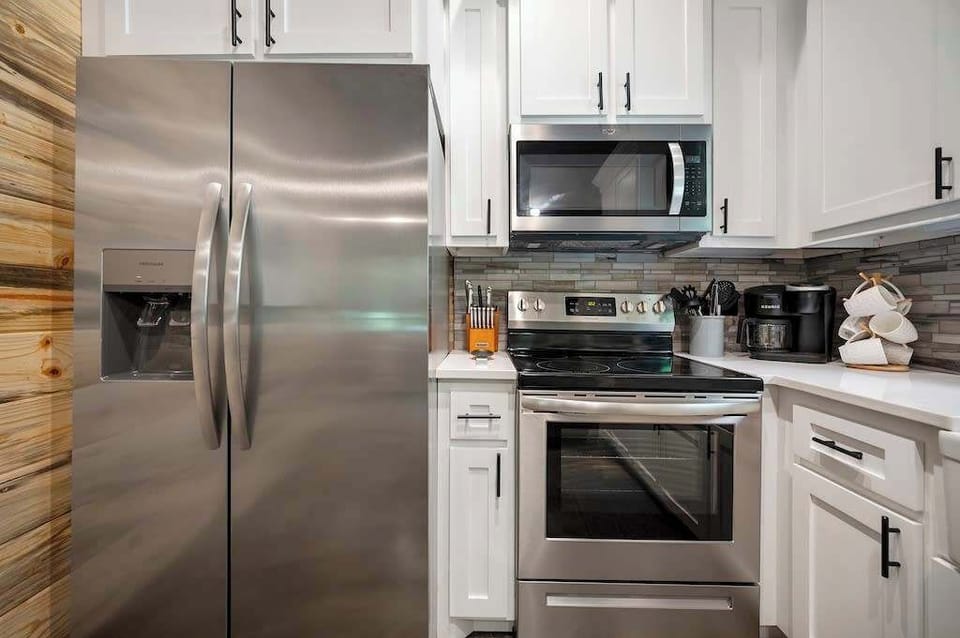 Stainless steel appliances give the kitchen an upscale feel.
