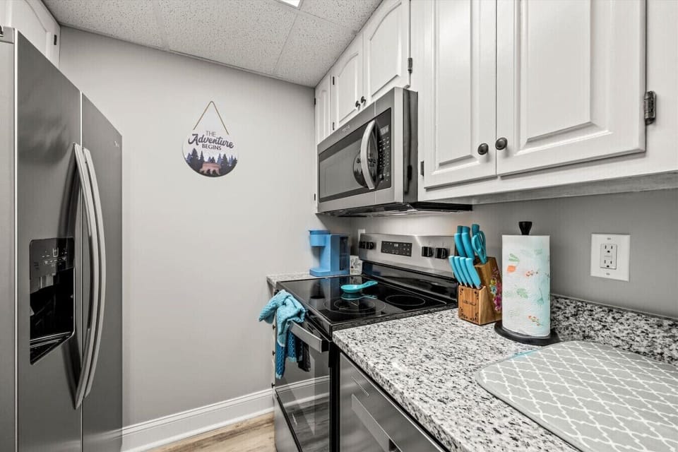 The kitchen is fully equipped with cookware, silverware, dishes, plates, cups, and more. It is the perfect spot to make meals inside or bring home takeout from any of the wonderful nearby Gatlinburg restaurants.