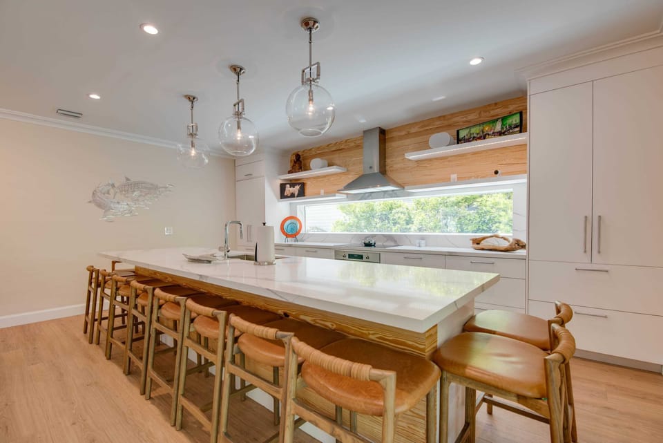 Gourmet kitchen with Keurig coffee machine, lots of cookware, and enough dishes and utensils for everyone