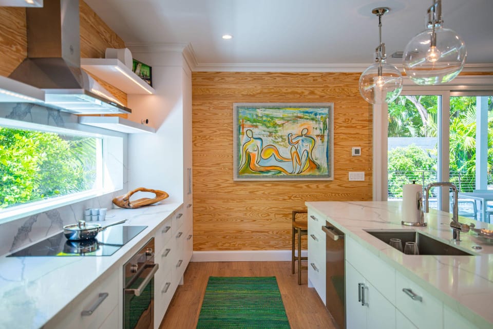 Gourmet kitchen with Keurig coffee machine, lots of cookware, and enough dishes and utensils for everyone