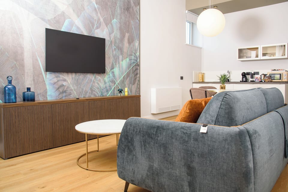 Exclusive Apartment | Living area | 36-inch flat-screen TV with digital channels