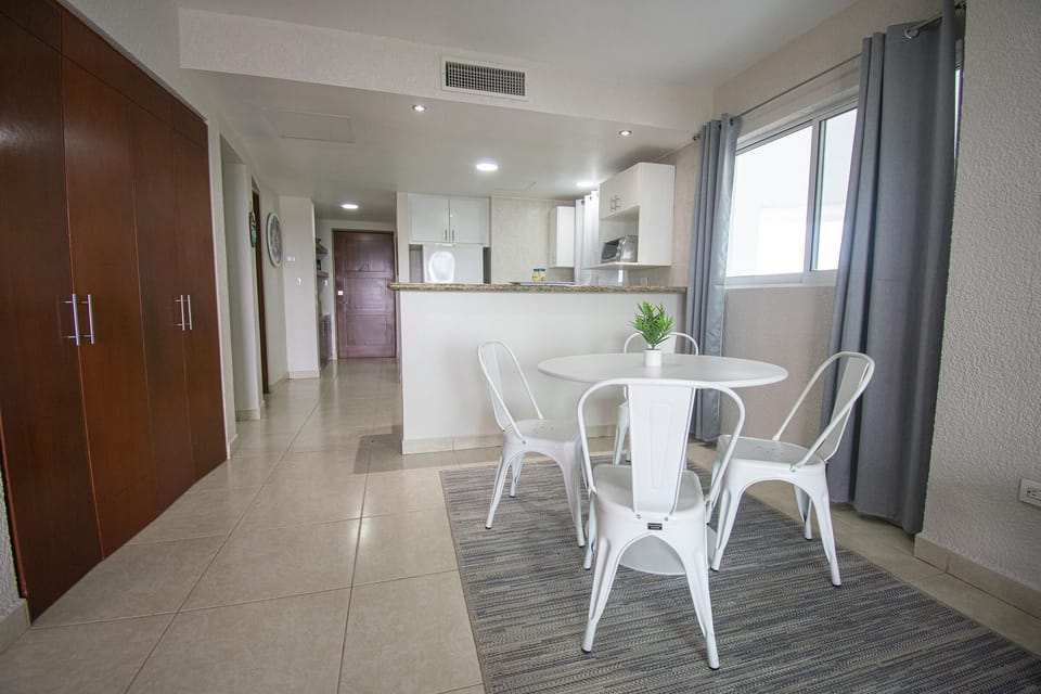 Bright, open dining area with modern kitchen access