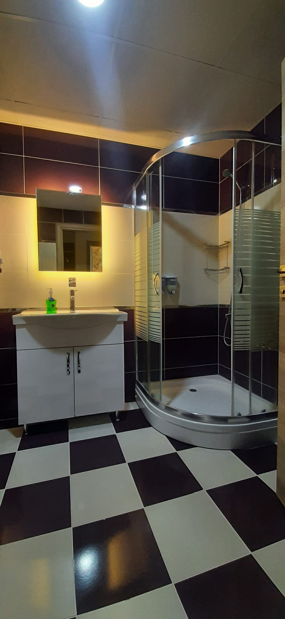 Shower, hair dryer, slippers, towels