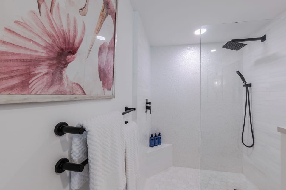 Enjoy the newly remodeled walk-in shower, complete with Beyond Blue's custom shampoo and conditioner