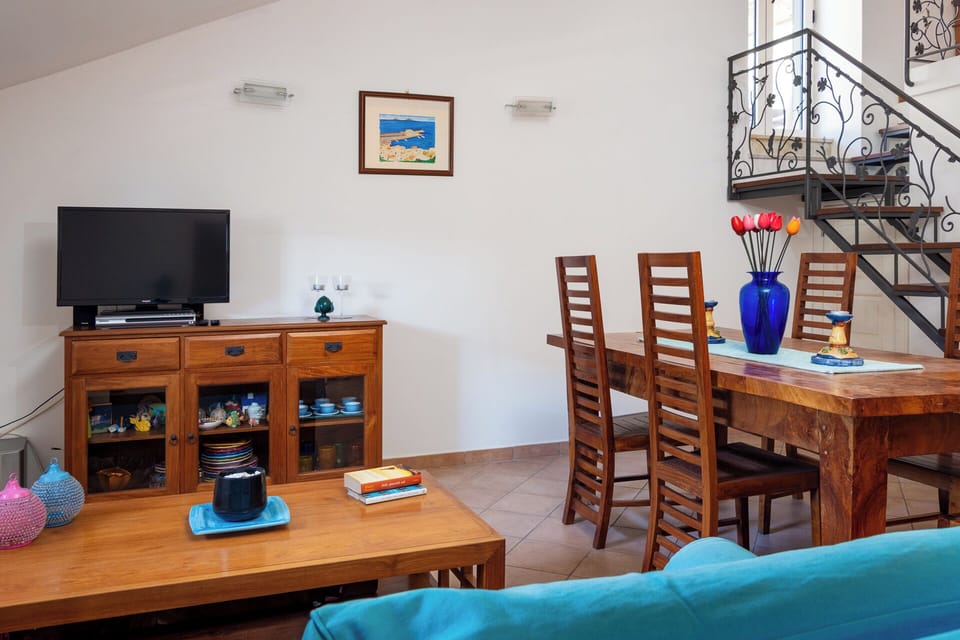 Family Apartment | Living area | 40-inch flat-screen TV with digital channels